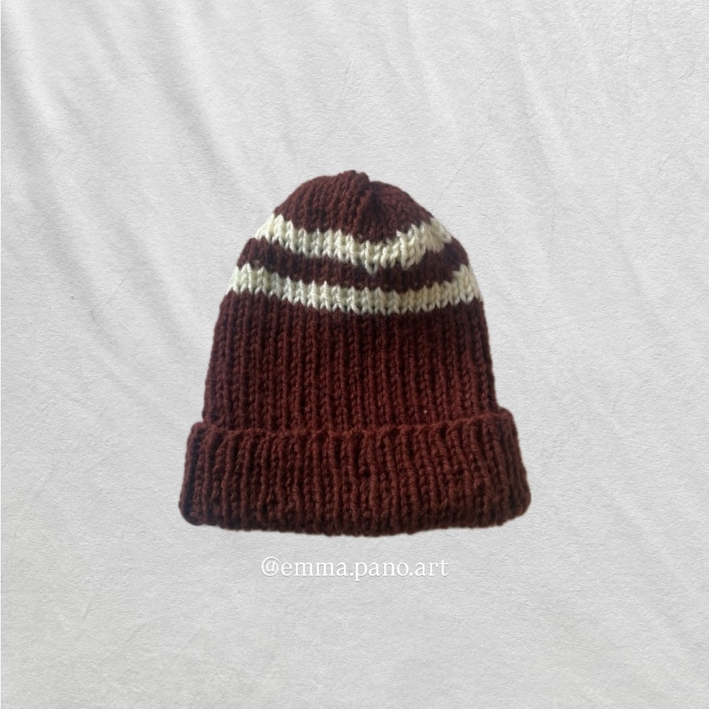 brown and white ribbed fisherman style beanie hat